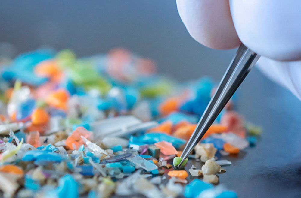 Mower at work on vibrant grass. Copy space web banner.